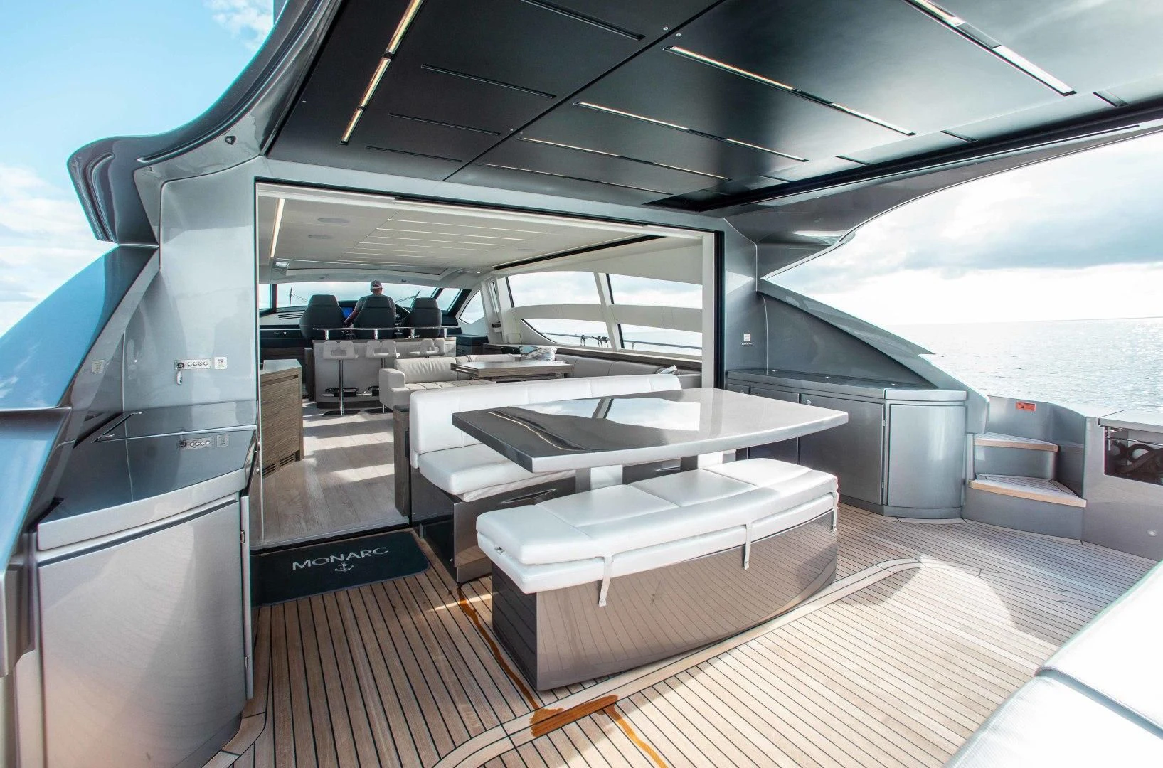 a room with a table and chairs aboard AFRICAN WILD DOG Yacht for Sale