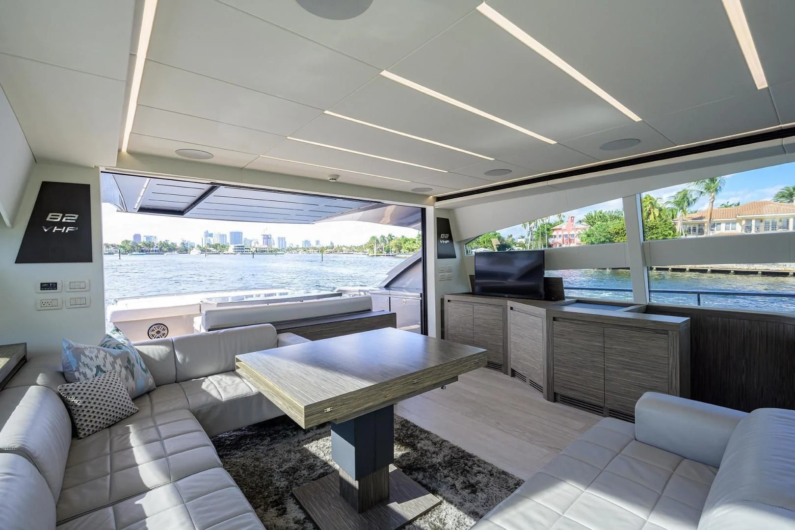 a living room with a couch and a table aboard AFRICAN WILD DOG Yacht for Sale