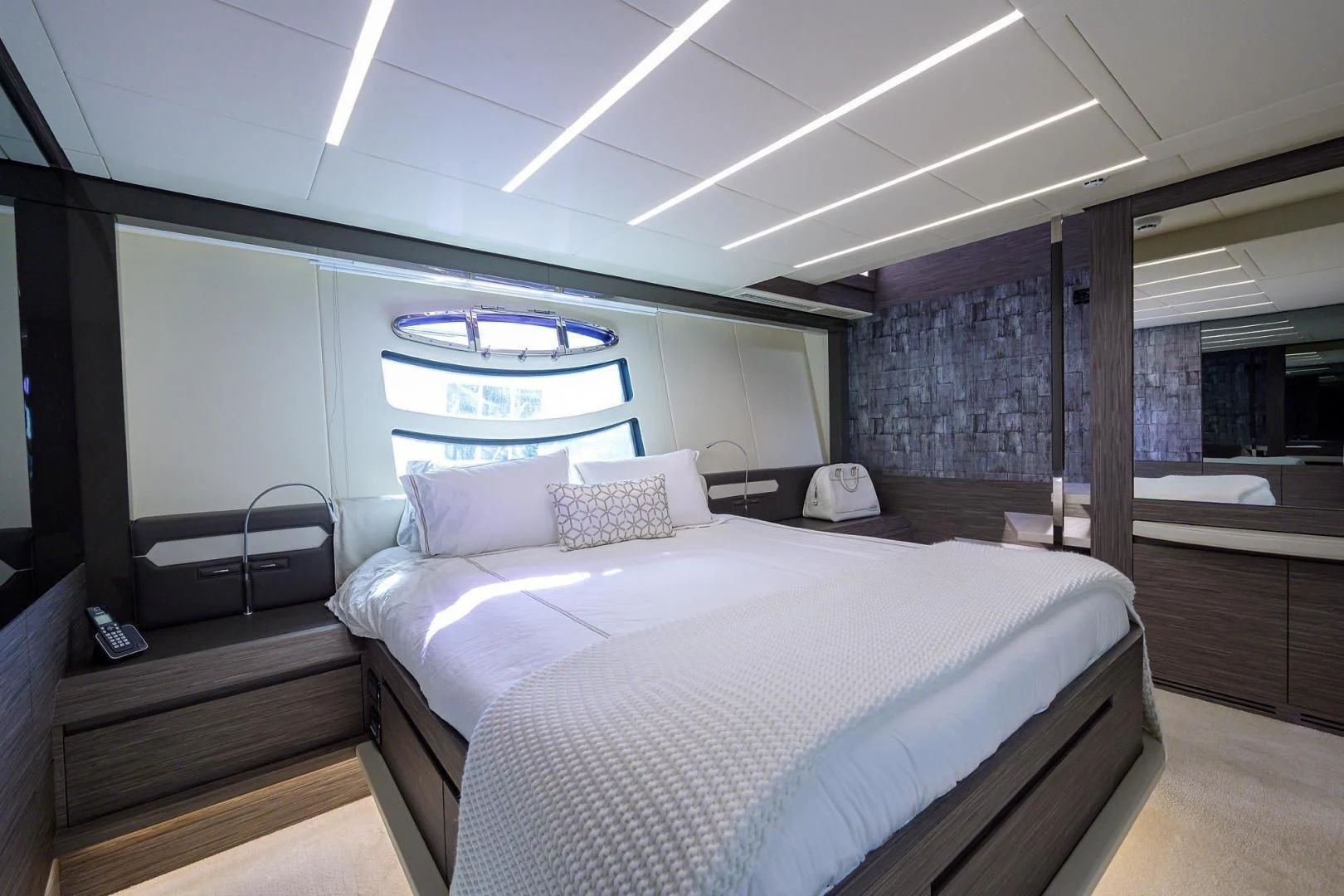 a room with a bed and a window aboard AFRICAN WILD DOG Yacht for Sale