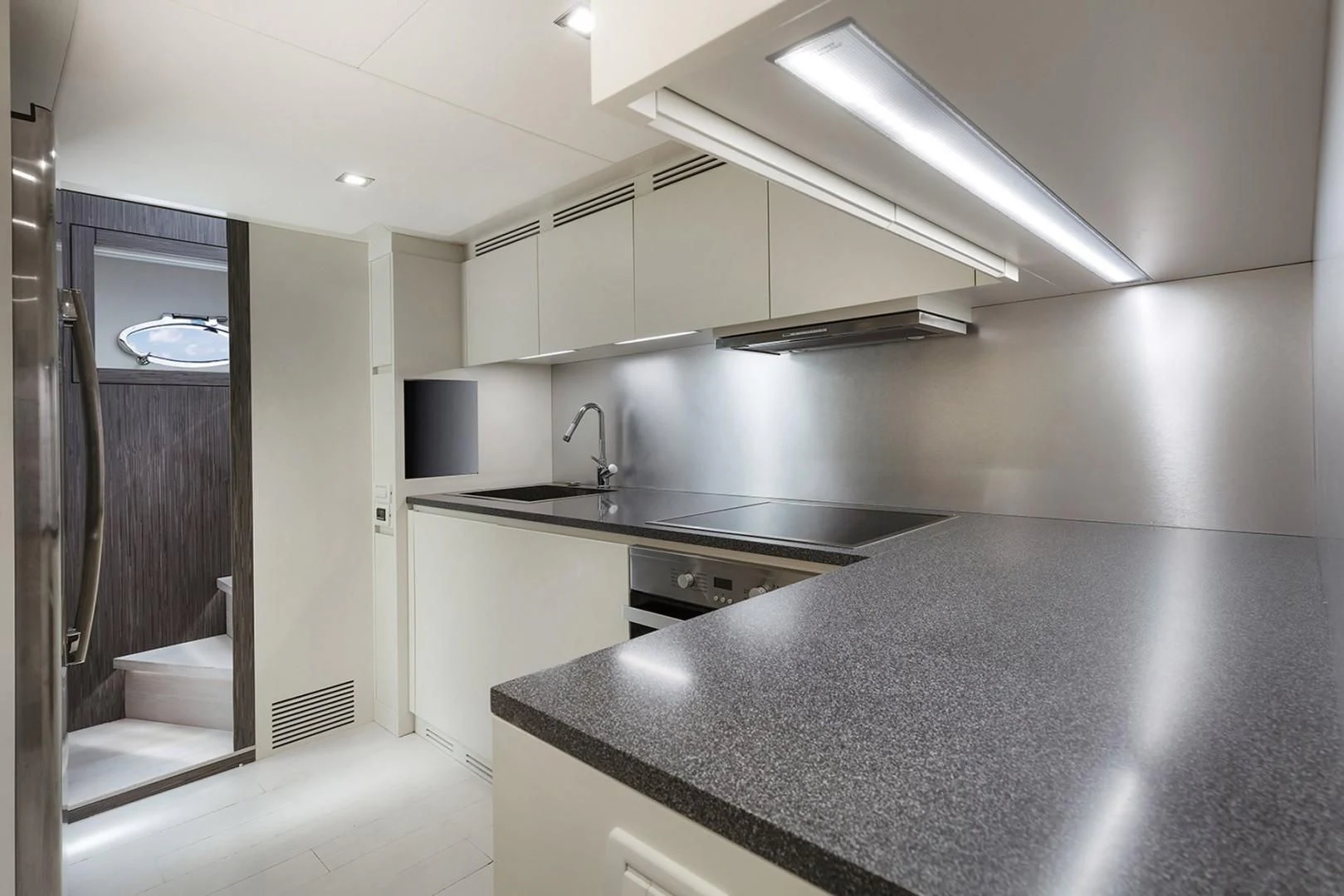a kitchen with a large island aboard AFRICAN WILD DOG Yacht for Sale