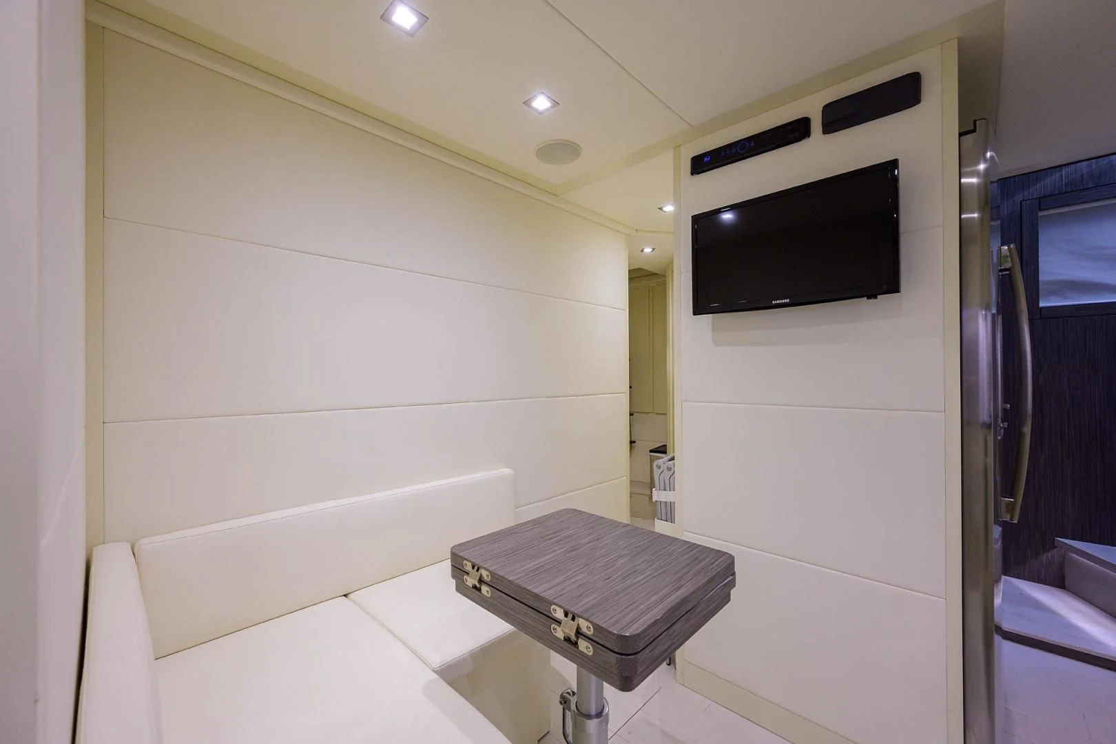 a tv mounted on a wall aboard AFRICAN WILD DOG Yacht for Sale