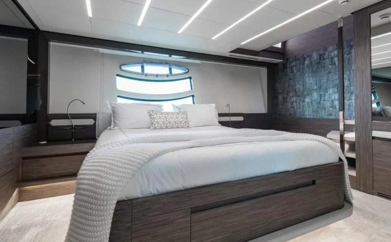 a bed with a large white bed aboard AFRICAN WILD DOG Yacht for Sale