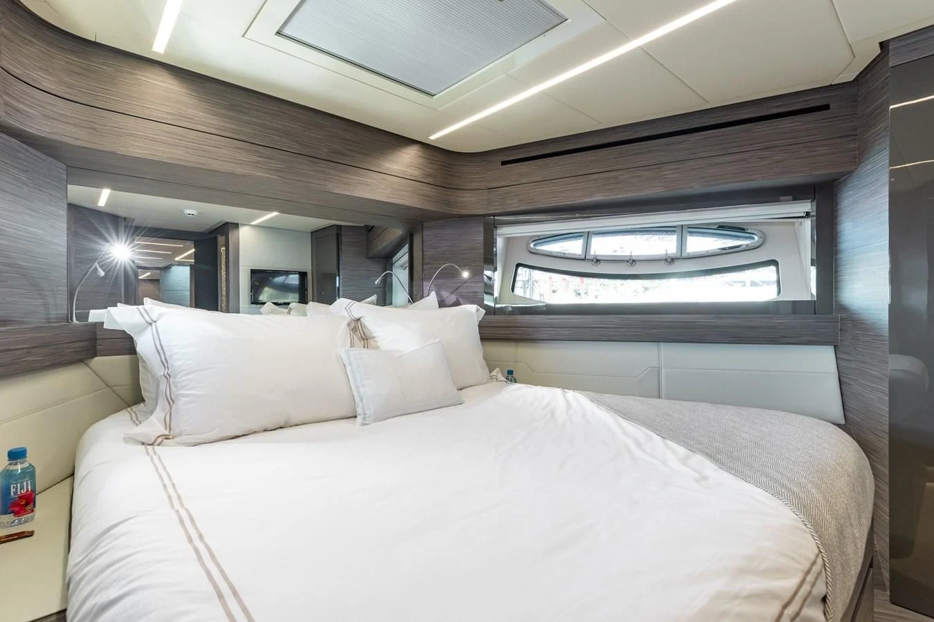a person lying in a bed aboard AFRICAN WILD DOG Yacht for Sale