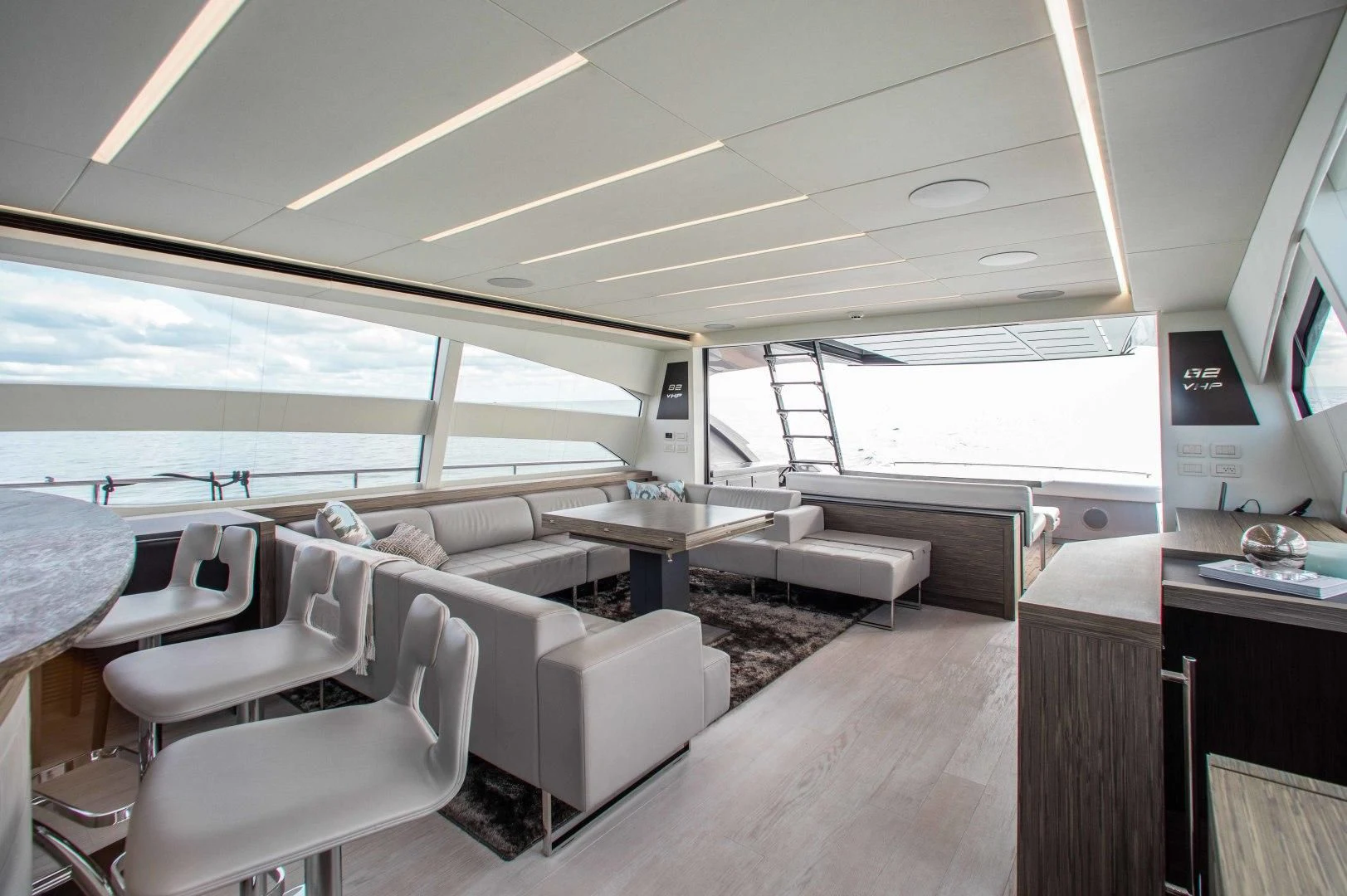 a room with a couch and a table and a television aboard AFRICAN WILD DOG Yacht for Sale