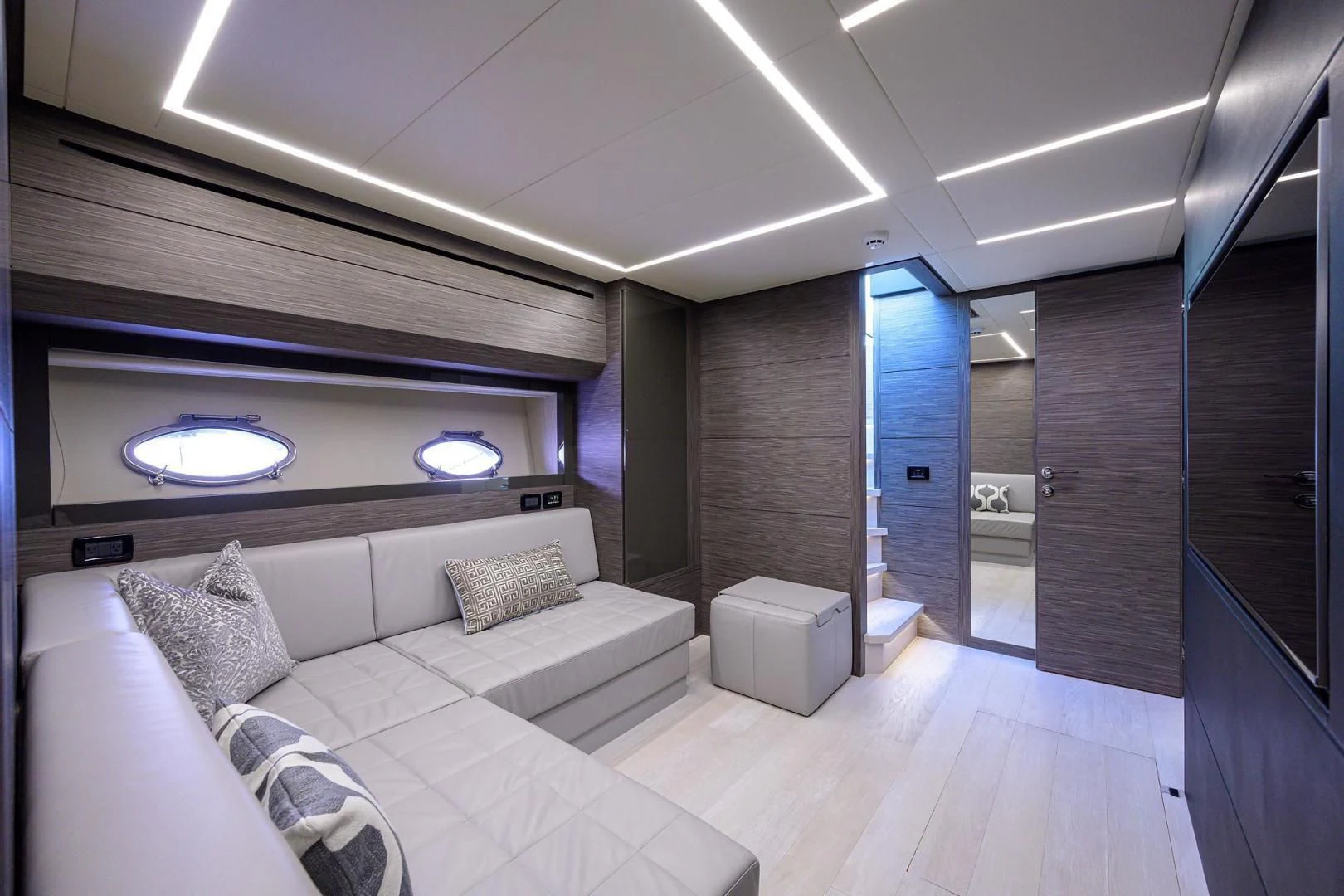 a room with a bed and a couch aboard AFRICAN WILD DOG Yacht for Sale