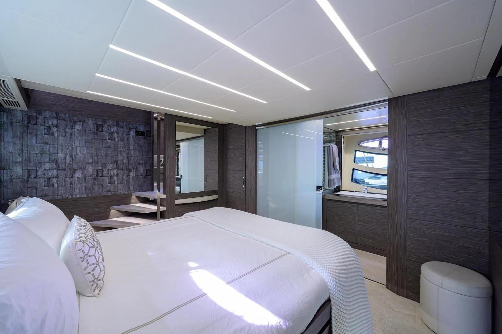 a room with a bed and a window aboard AFRICAN WILD DOG Yacht for Sale