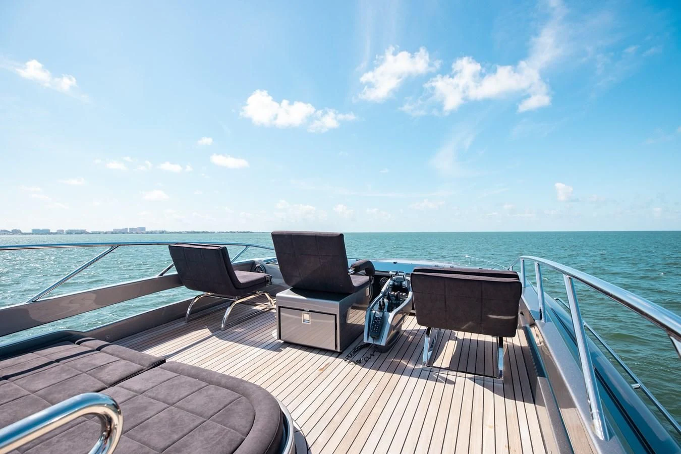 a deck with chairs and a table on it aboard AFRICAN WILD DOG Yacht for Sale