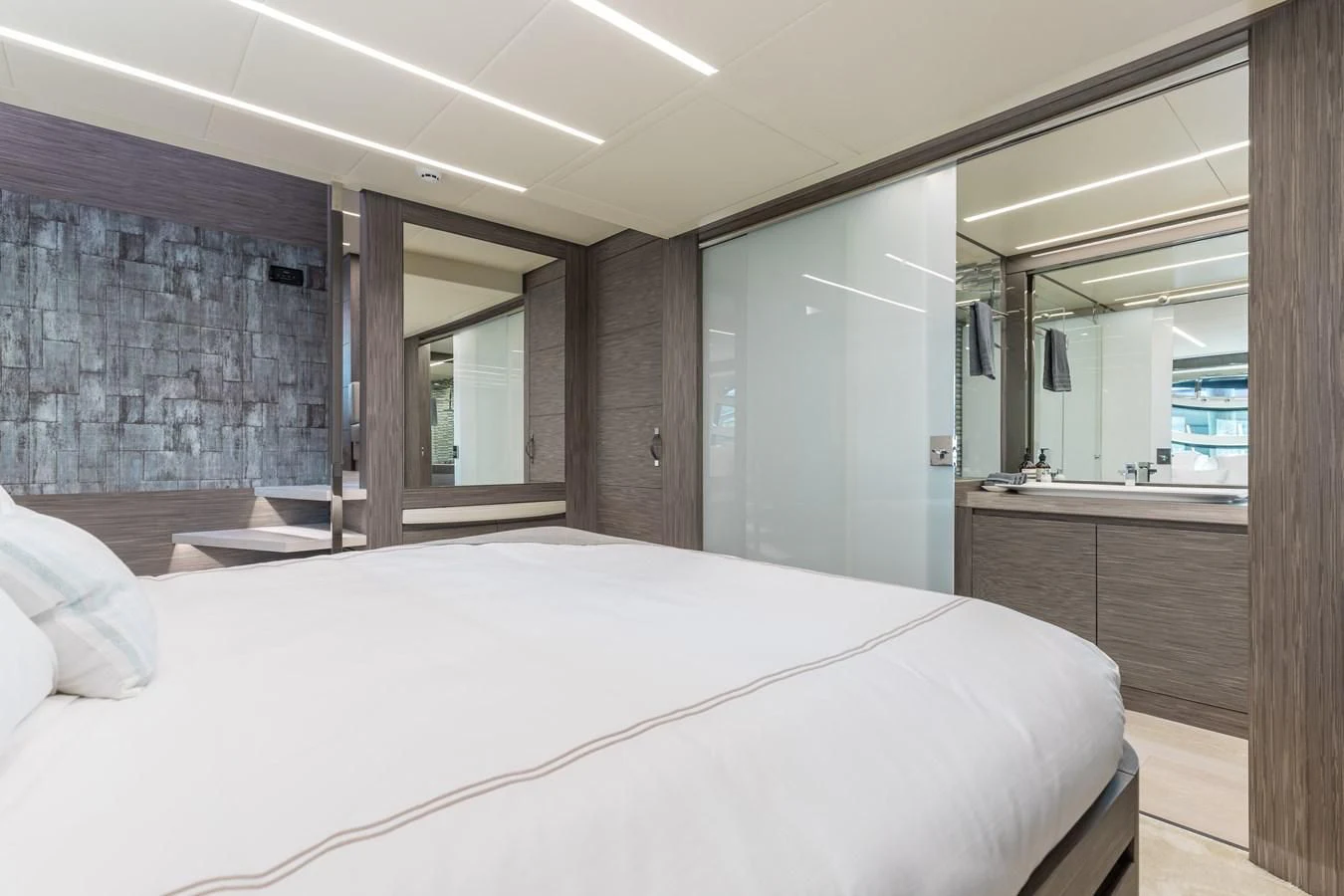 a large bedroom with a large bed aboard AFRICAN WILD DOG Yacht for Sale