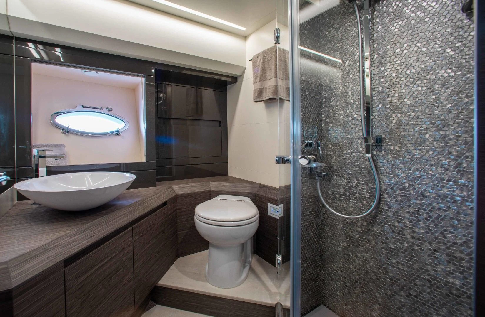 a bathroom with a sink toilet and a mirror aboard AFRICAN WILD DOG Yacht for Sale