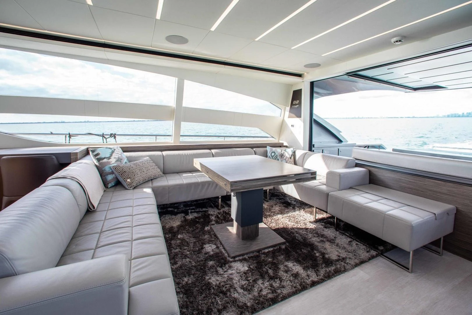 a living room with a couch and a table aboard AFRICAN WILD DOG Yacht for Sale