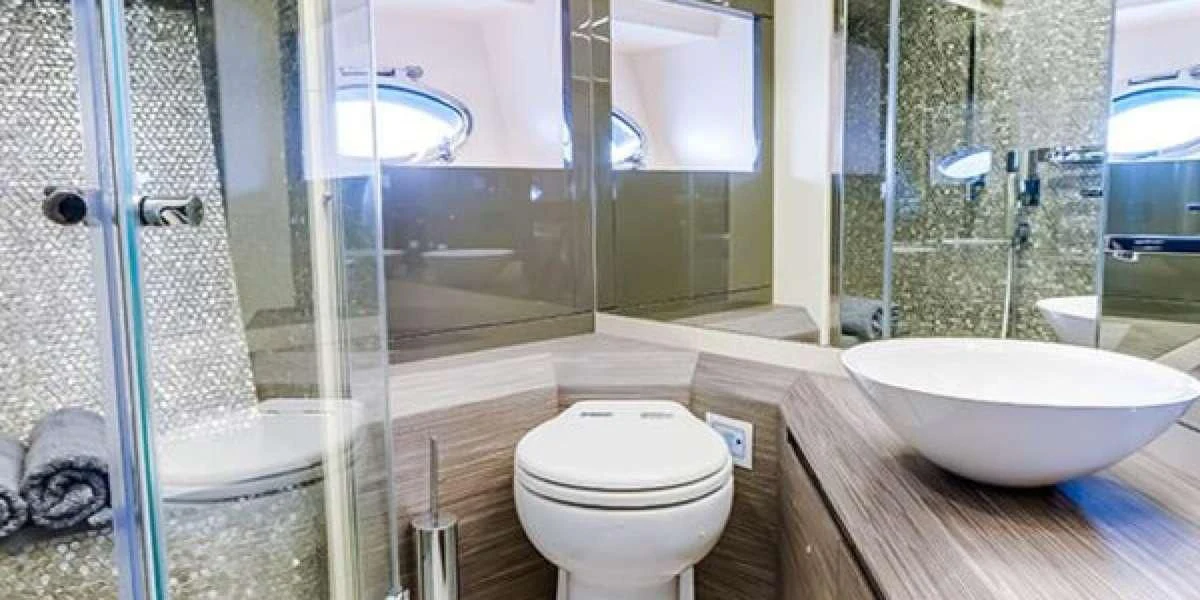 a bathroom with a glass shower aboard AFRICAN WILD DOG Yacht for Sale