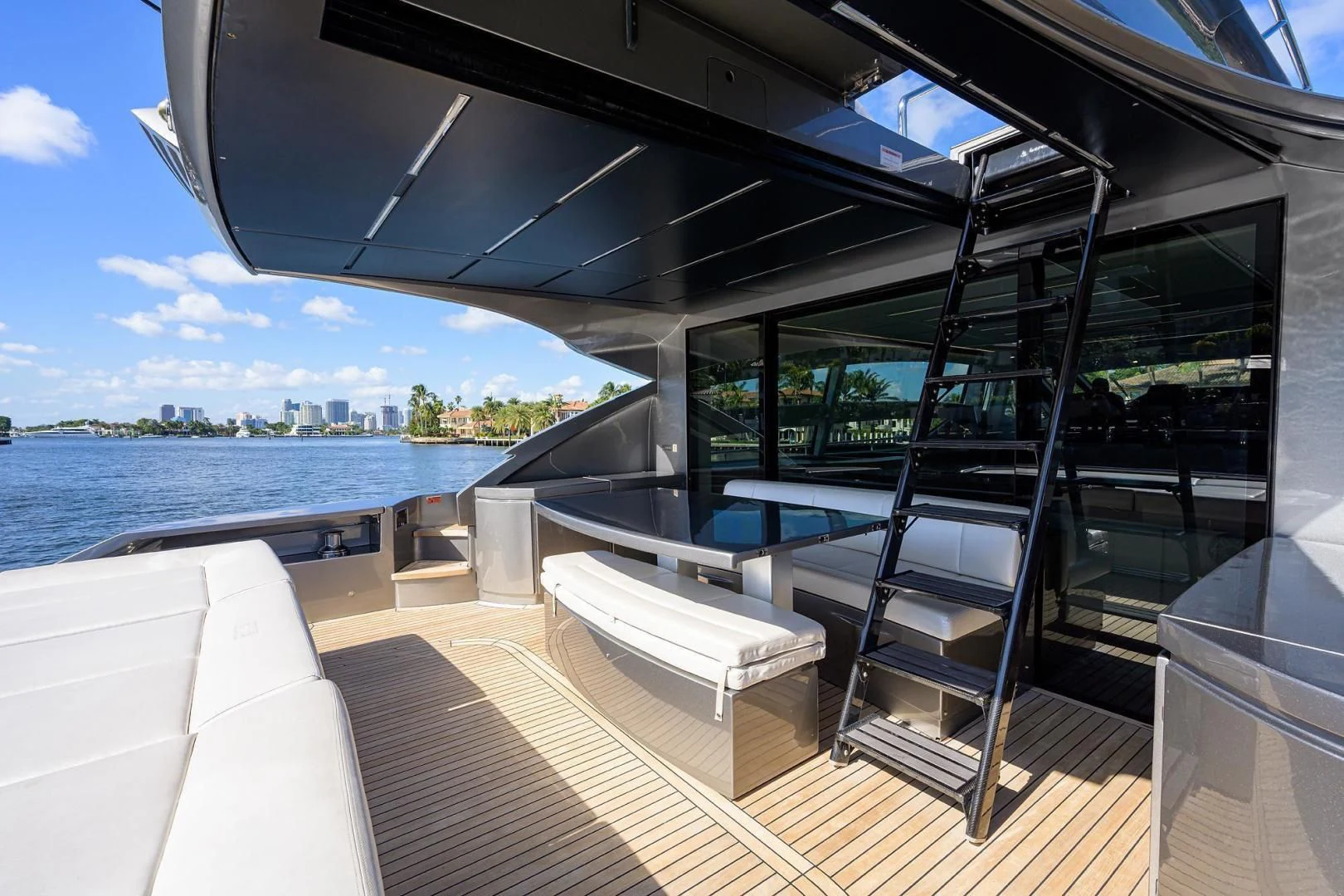 a room with a view of a city and water aboard AFRICAN WILD DOG Yacht for Sale