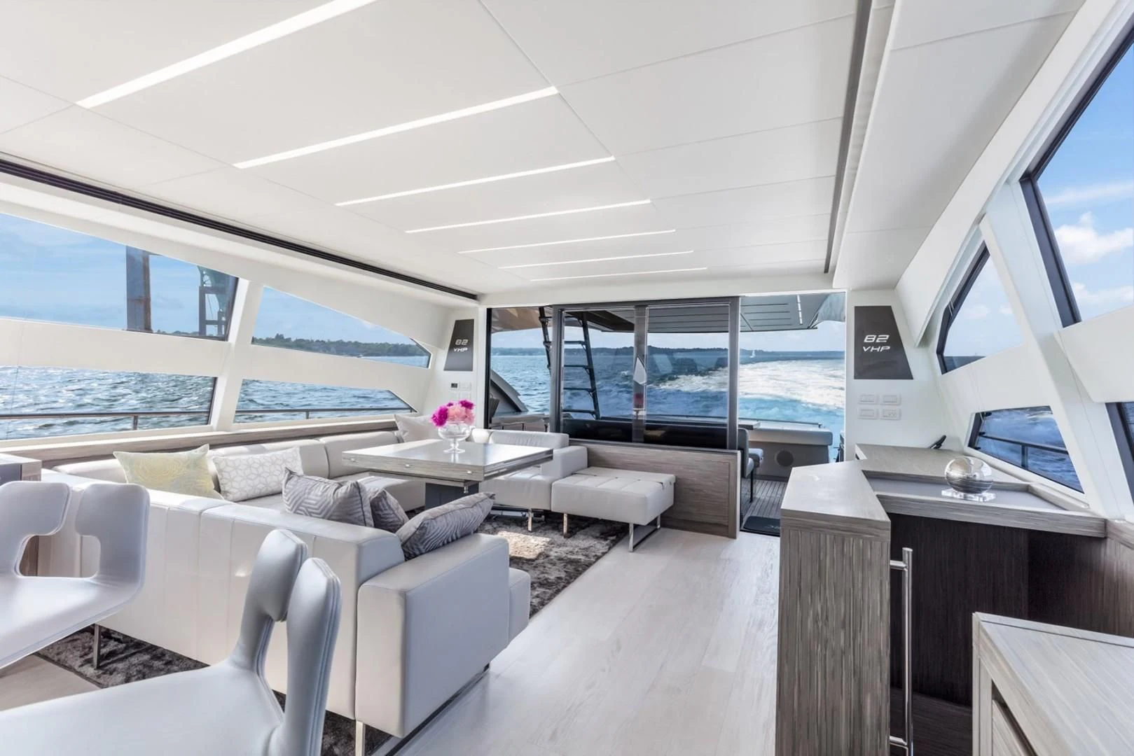 a room with a large window and a view of the ocean aboard AFRICAN WILD DOG Yacht for Sale