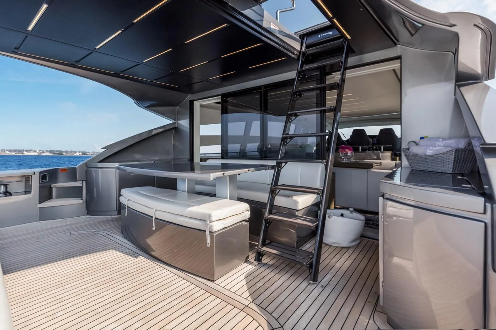 a room with a large window and a table with chairs aboard AFRICAN WILD DOG Yacht for Sale