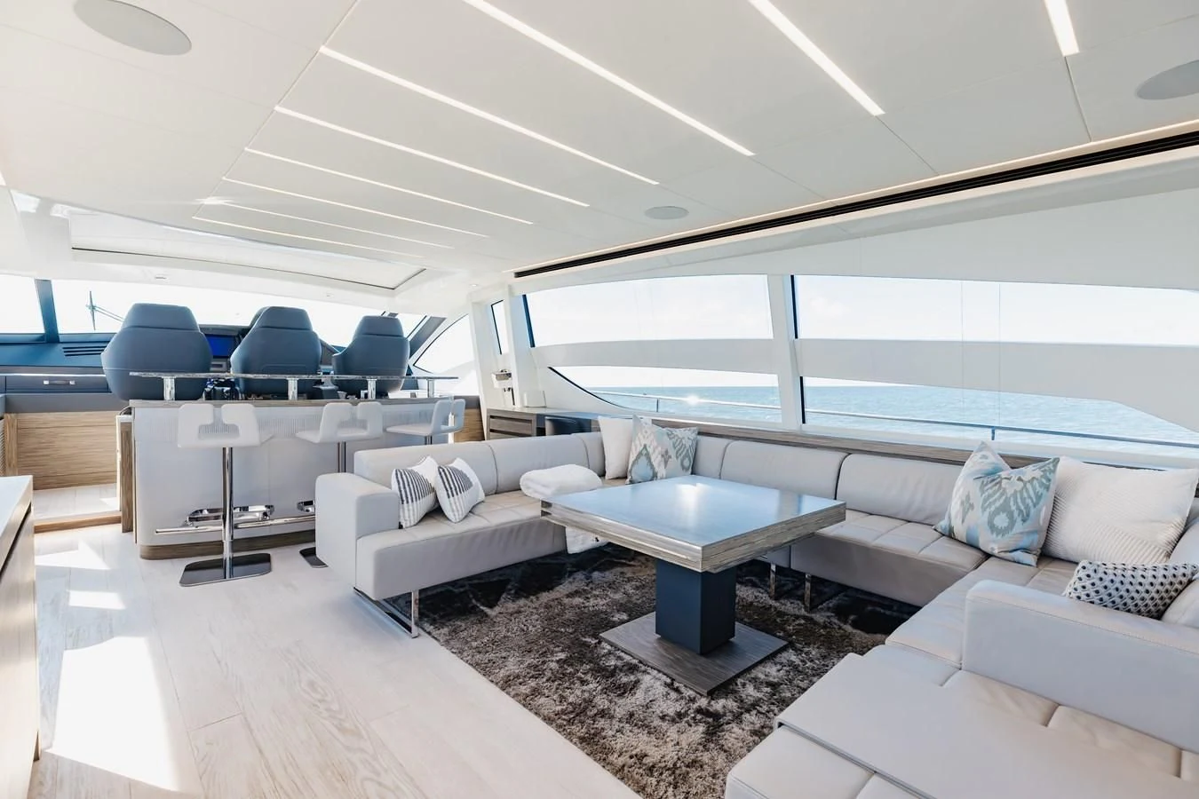 a living room with a couch and a table aboard AFRICAN WILD DOG Yacht for Sale