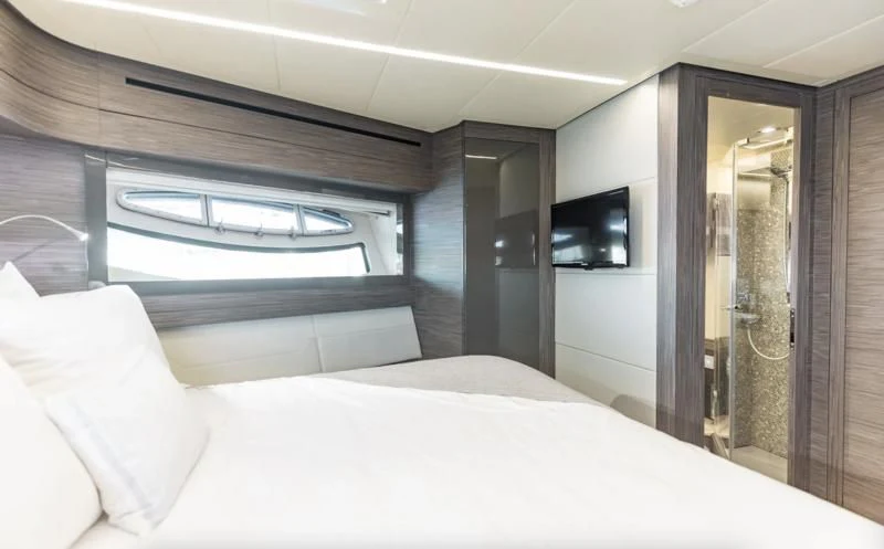 a bed in a room aboard AFRICAN WILD DOG Yacht for Sale