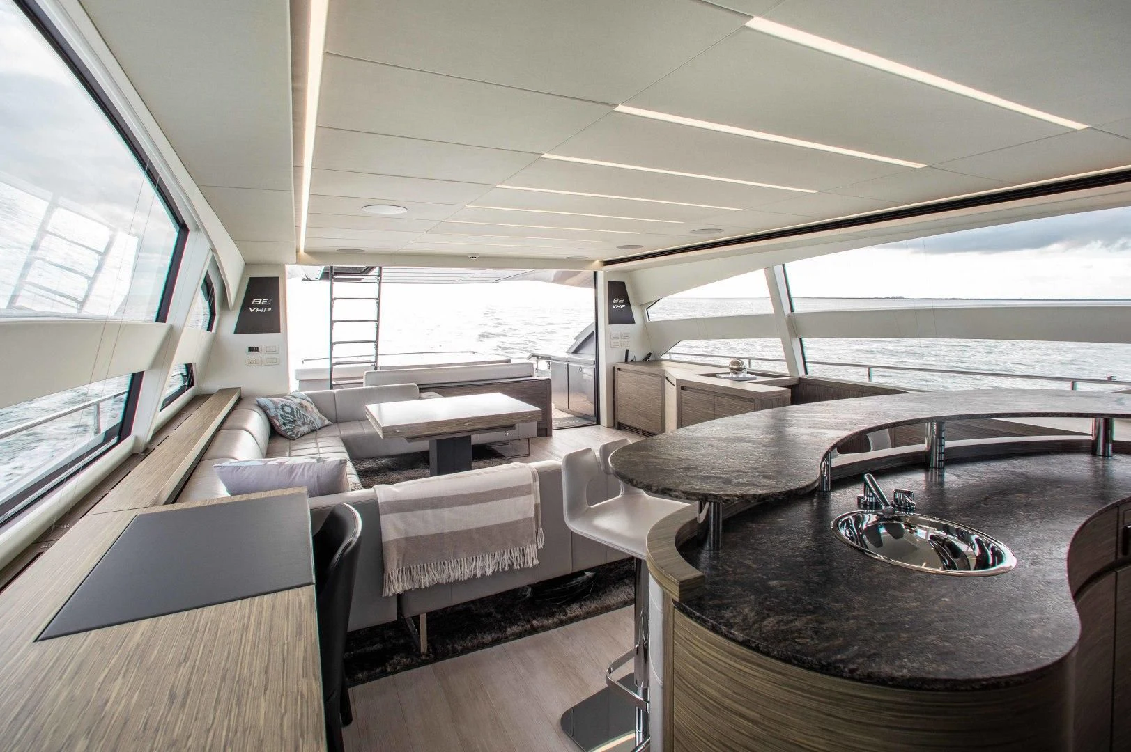 a room with a table and chairs aboard AFRICAN WILD DOG Yacht for Sale