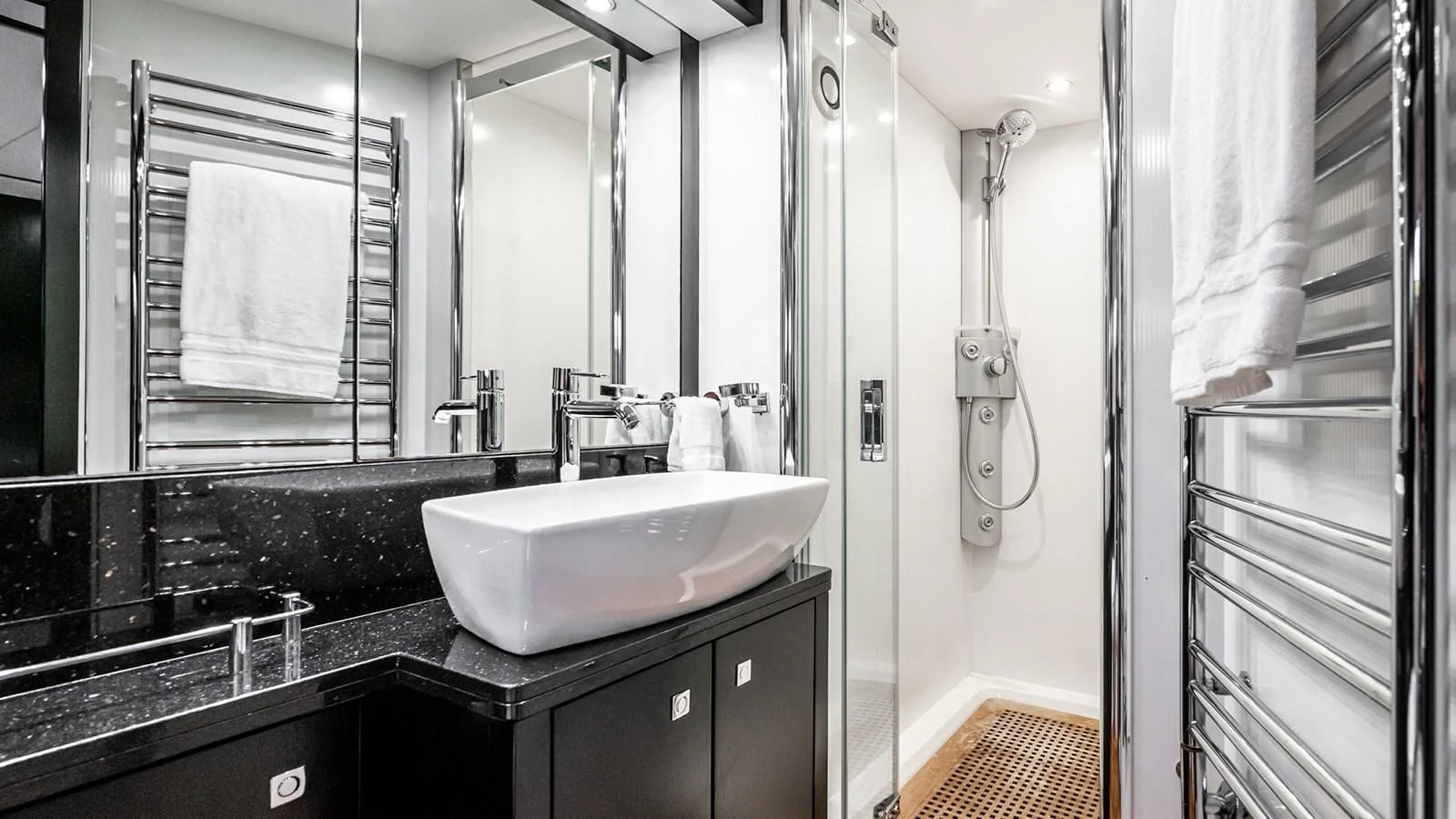 a bathroom with a sink and a mirror aboard NORMA JEAN Yacht for Sale
