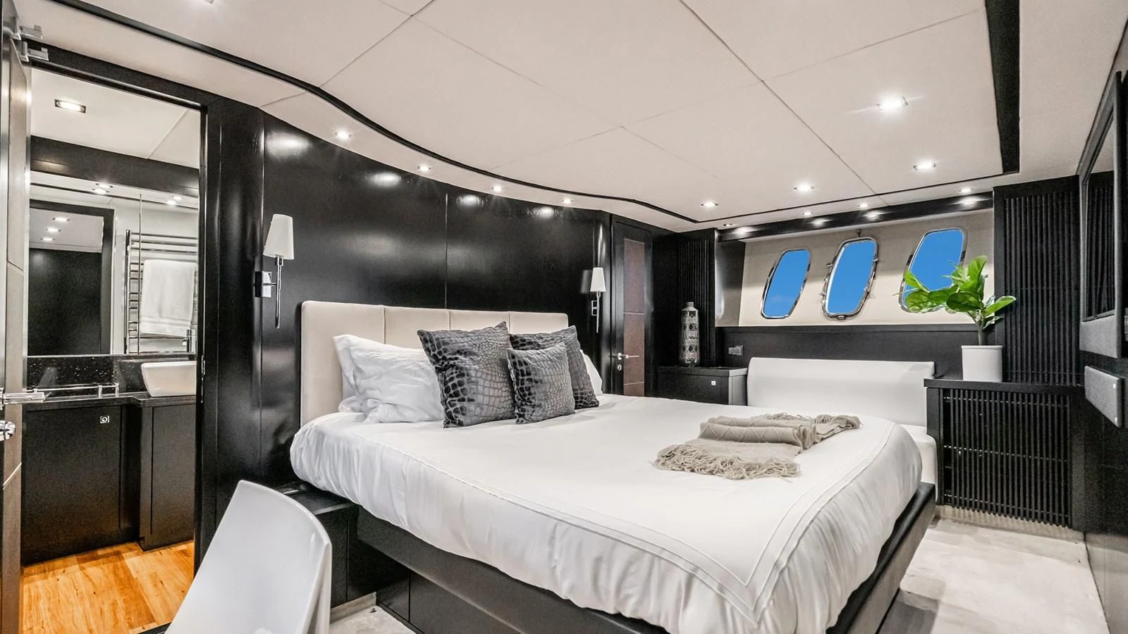 a room with a bed and a desk aboard NORMA JEAN Yacht for Sale