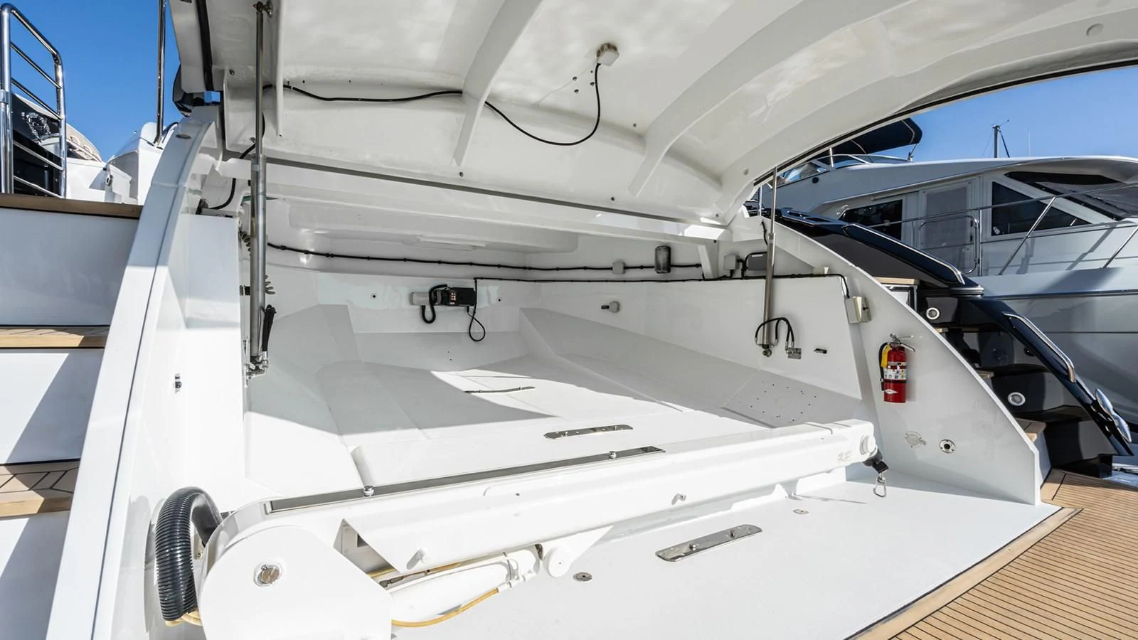 a white boat on a deck aboard NORMA JEAN Yacht for Sale