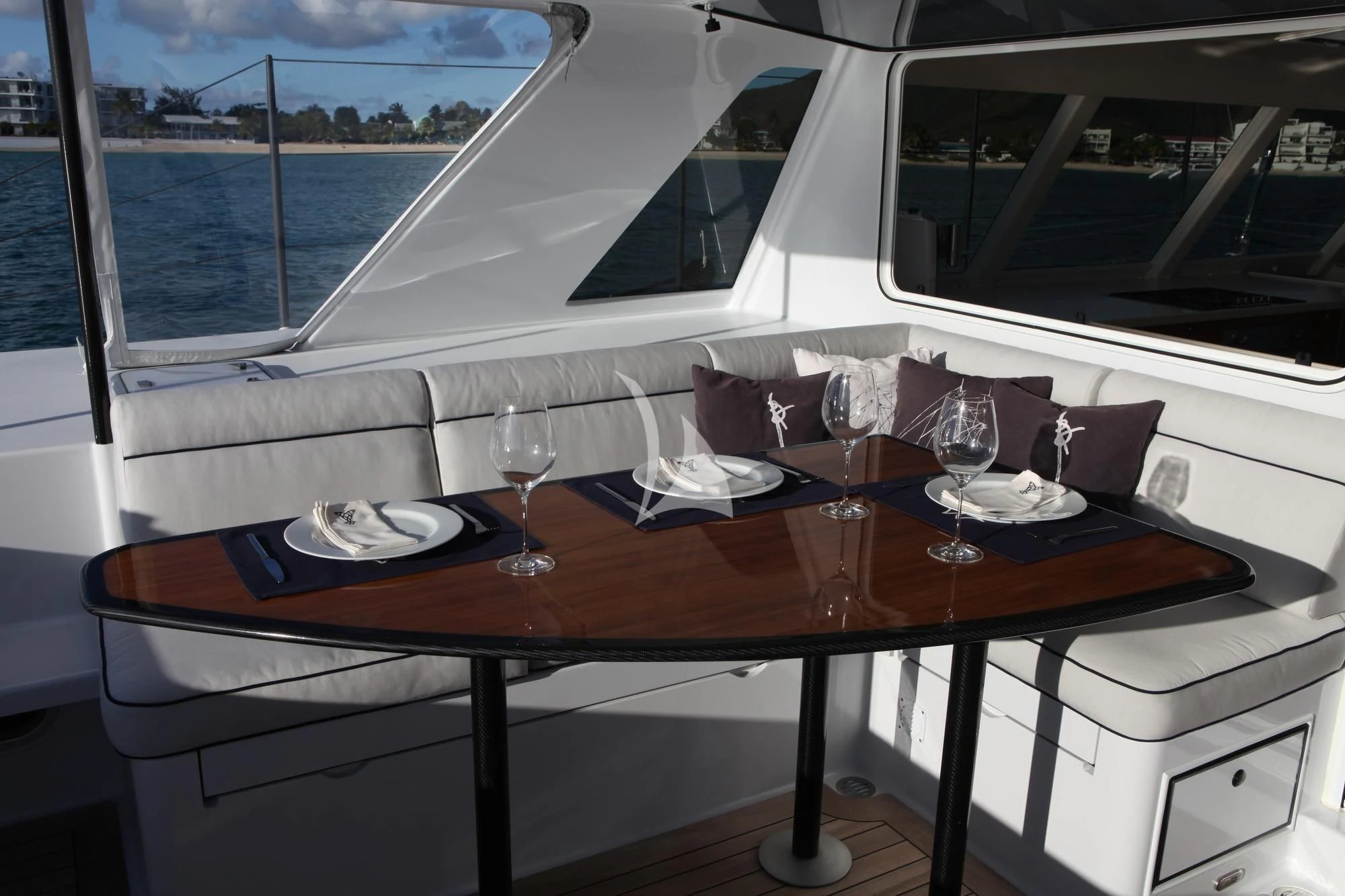 a table with wine glasses on it aboard SLIM Yacht for Charter