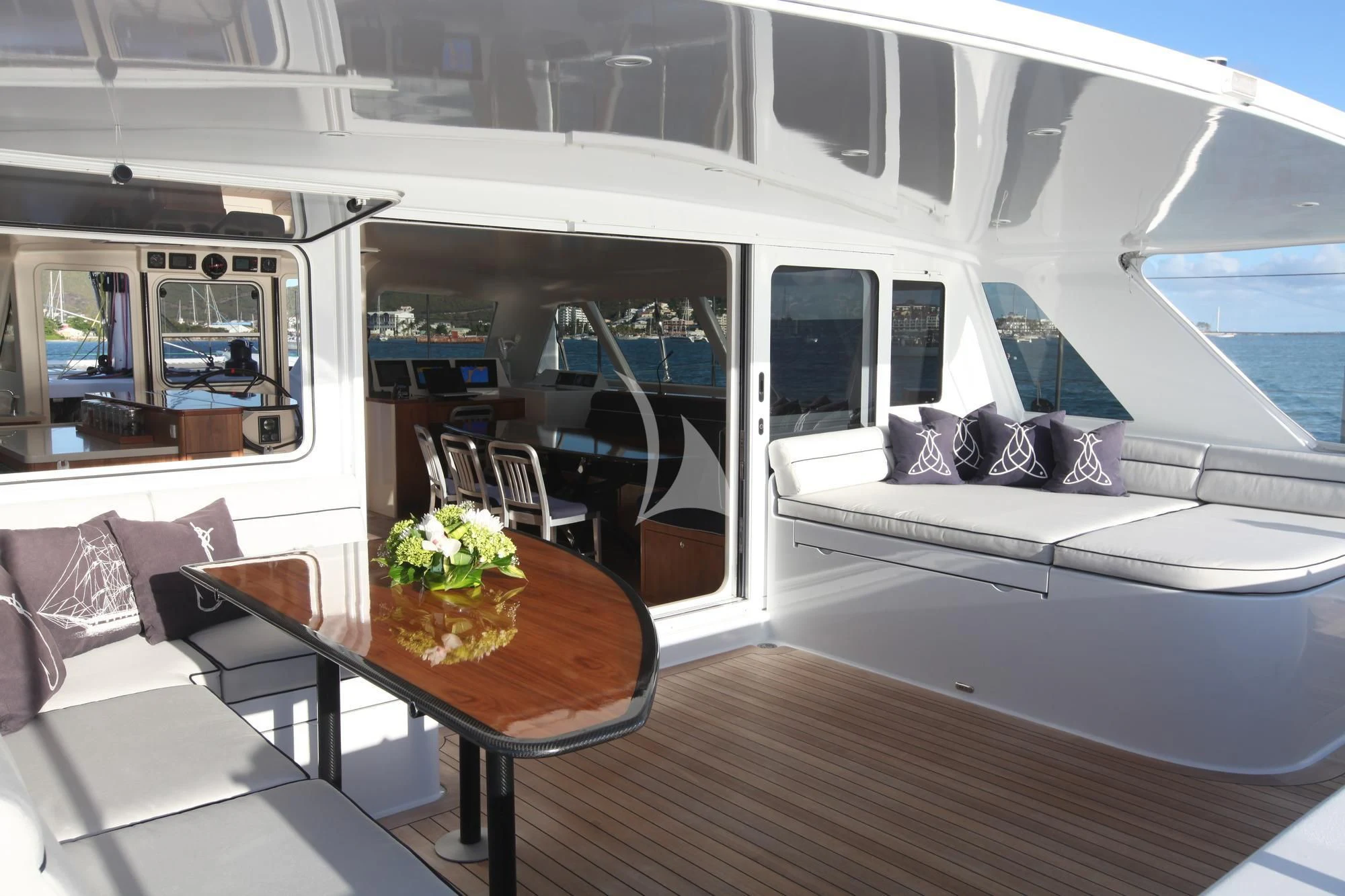a room with a table and chairs aboard SLIM Yacht for Charter