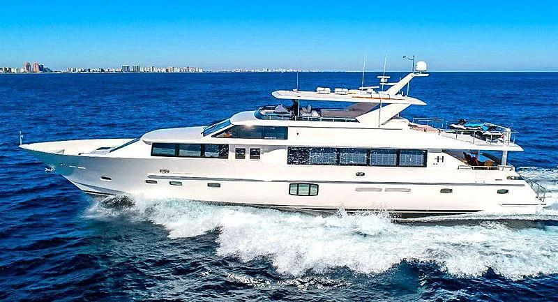 a large white boat on the water aboard RISK TAKER Yacht for Charter