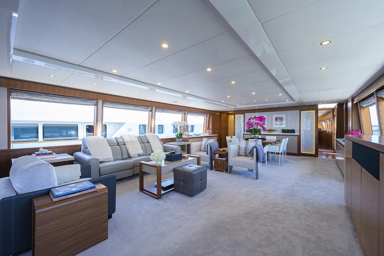 a large living room with a large open floor plan aboard RISK TAKER Yacht for Charter