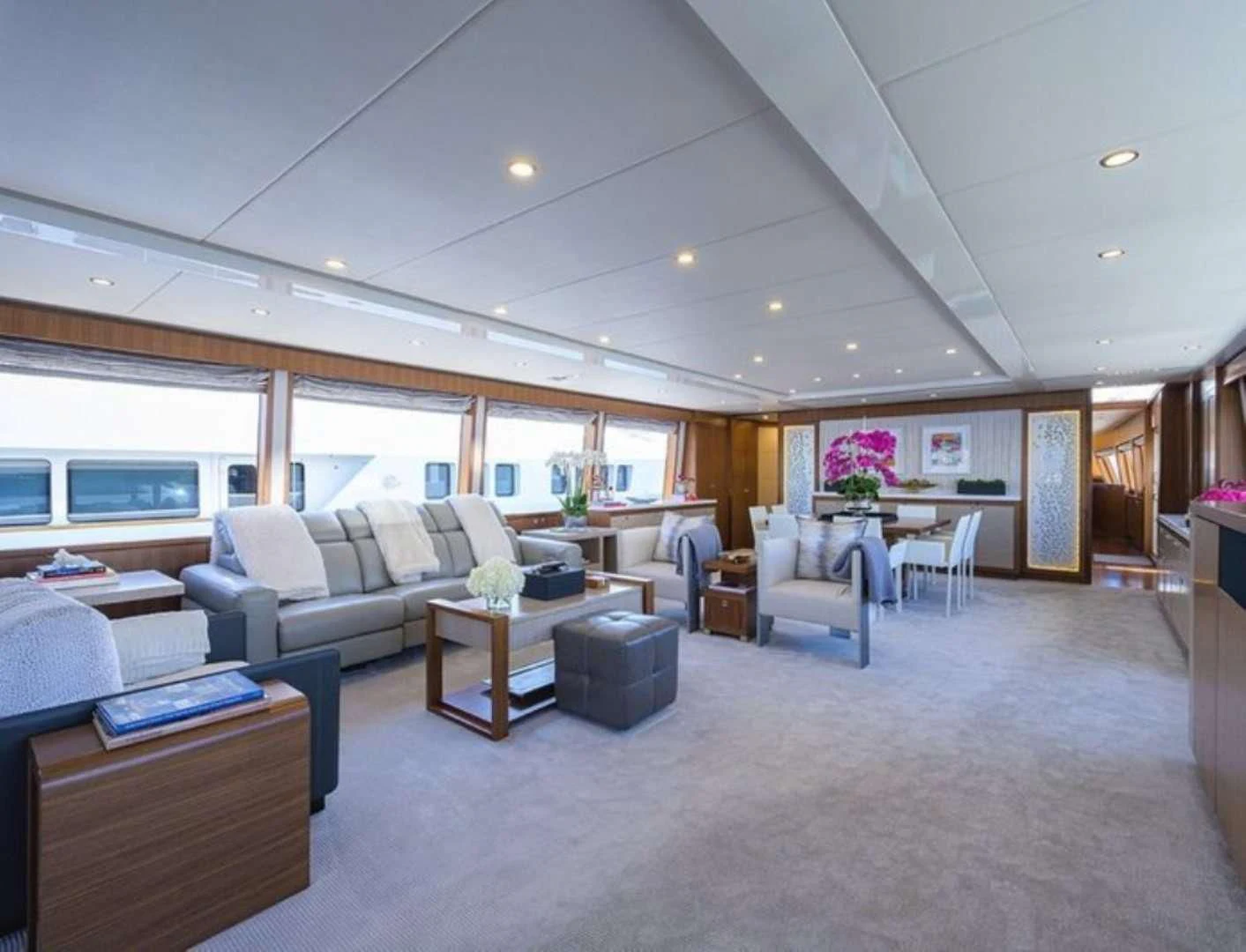a large living room with a large open floor plan aboard RISK TAKER Yacht for Charter
