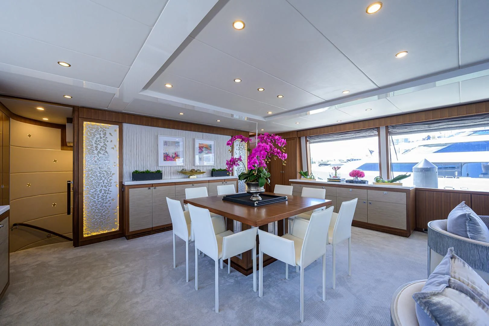 a kitchen with a table and chairs aboard RISK TAKER Yacht for Charter