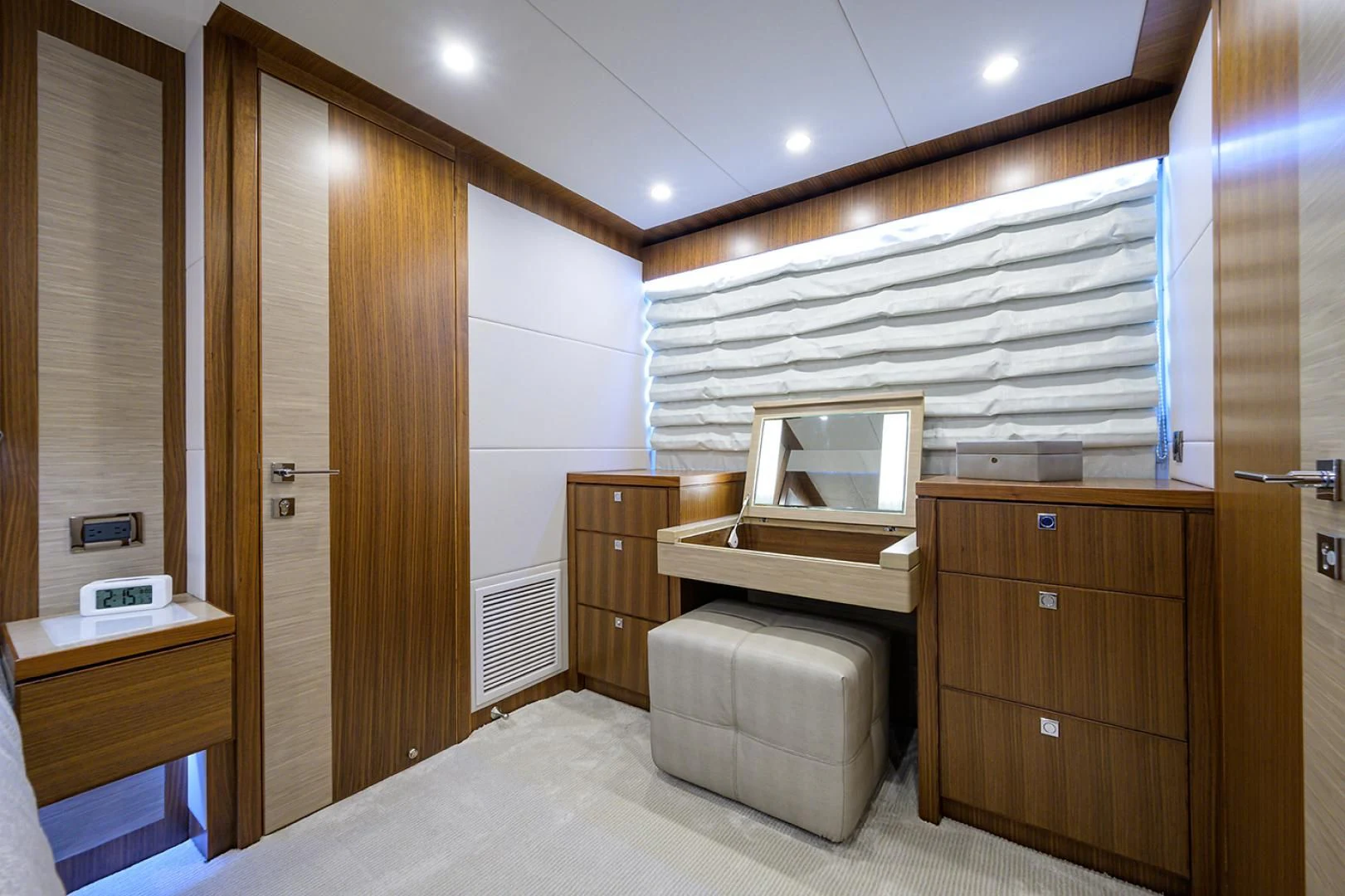 a bedroom with a bed and a desk aboard RISK TAKER Yacht for Charter