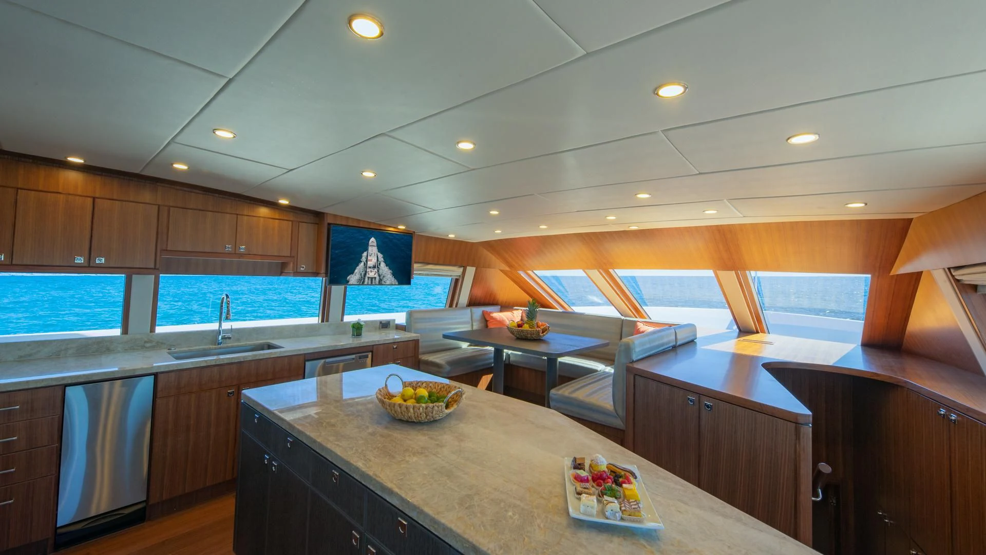 a kitchen with a large island aboard RISK TAKER Yacht for Charter