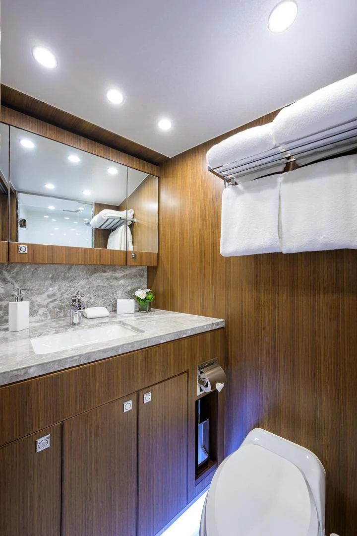 a bathroom with a sink and a mirror aboard RISK TAKER Yacht for Charter