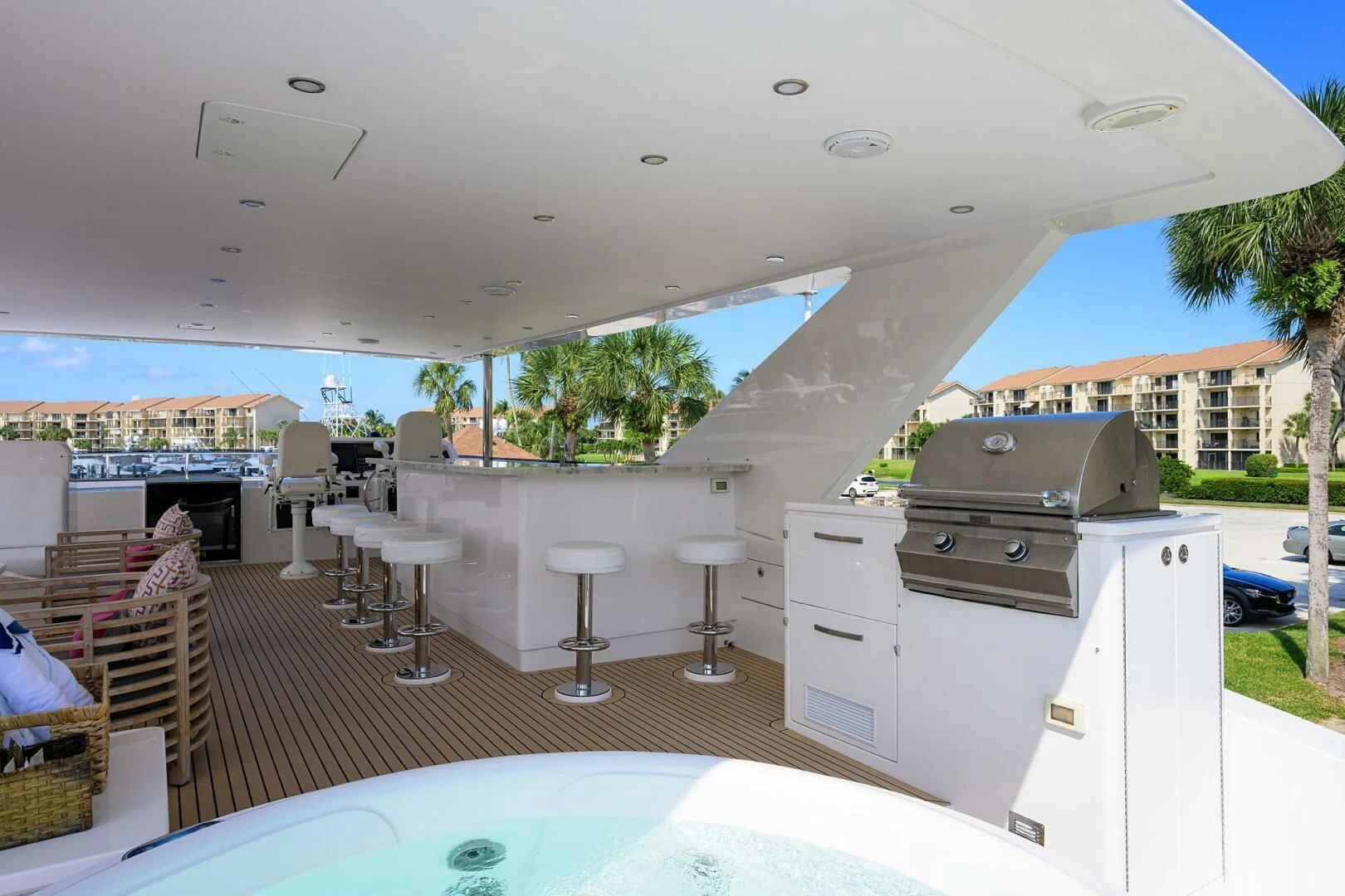 a large white room with a pool table and chairs aboard RISK TAKER Yacht for Charter