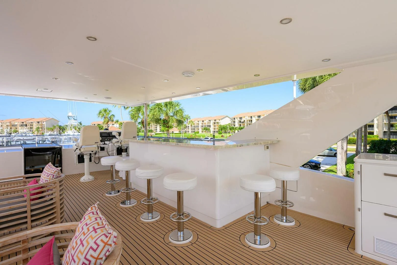 a room with a balcony and a view of the water aboard RISK TAKER Yacht for Charter