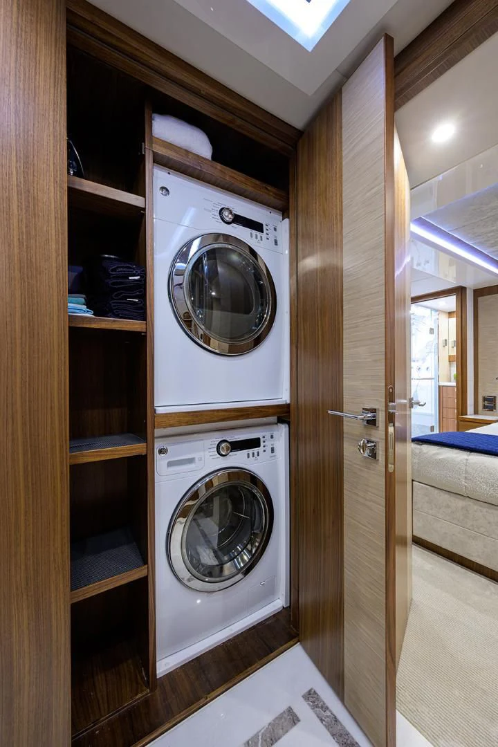 a washer and dryer in a room aboard RISK TAKER Yacht for Charter