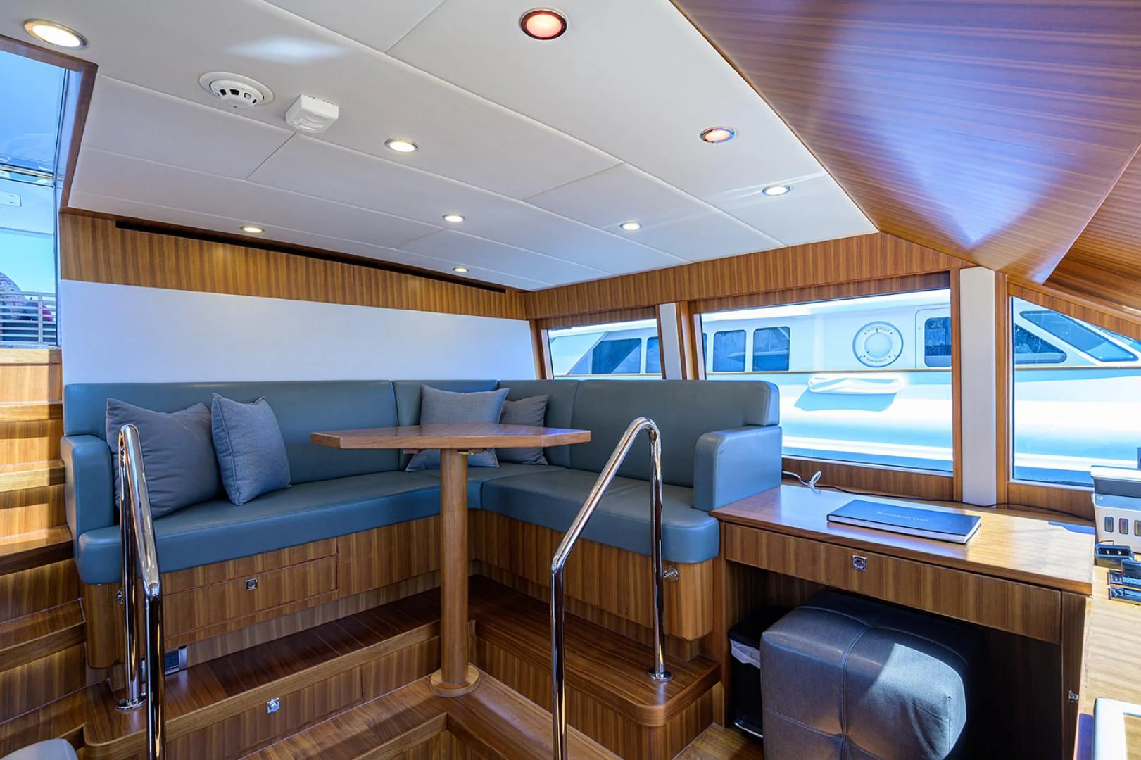 a room with a couch and a desk aboard RISK TAKER Yacht for Charter