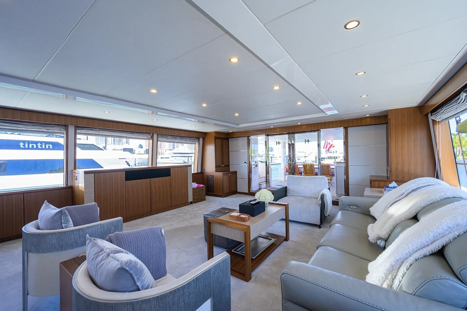 a living room with a couch and a coffee table aboard RISK TAKER Yacht for Charter