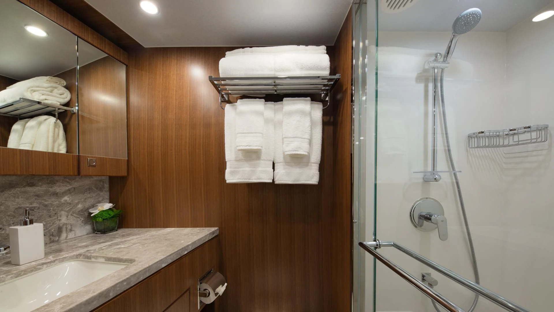 a bathroom with a sink and a mirror aboard RISK TAKER Yacht for Charter