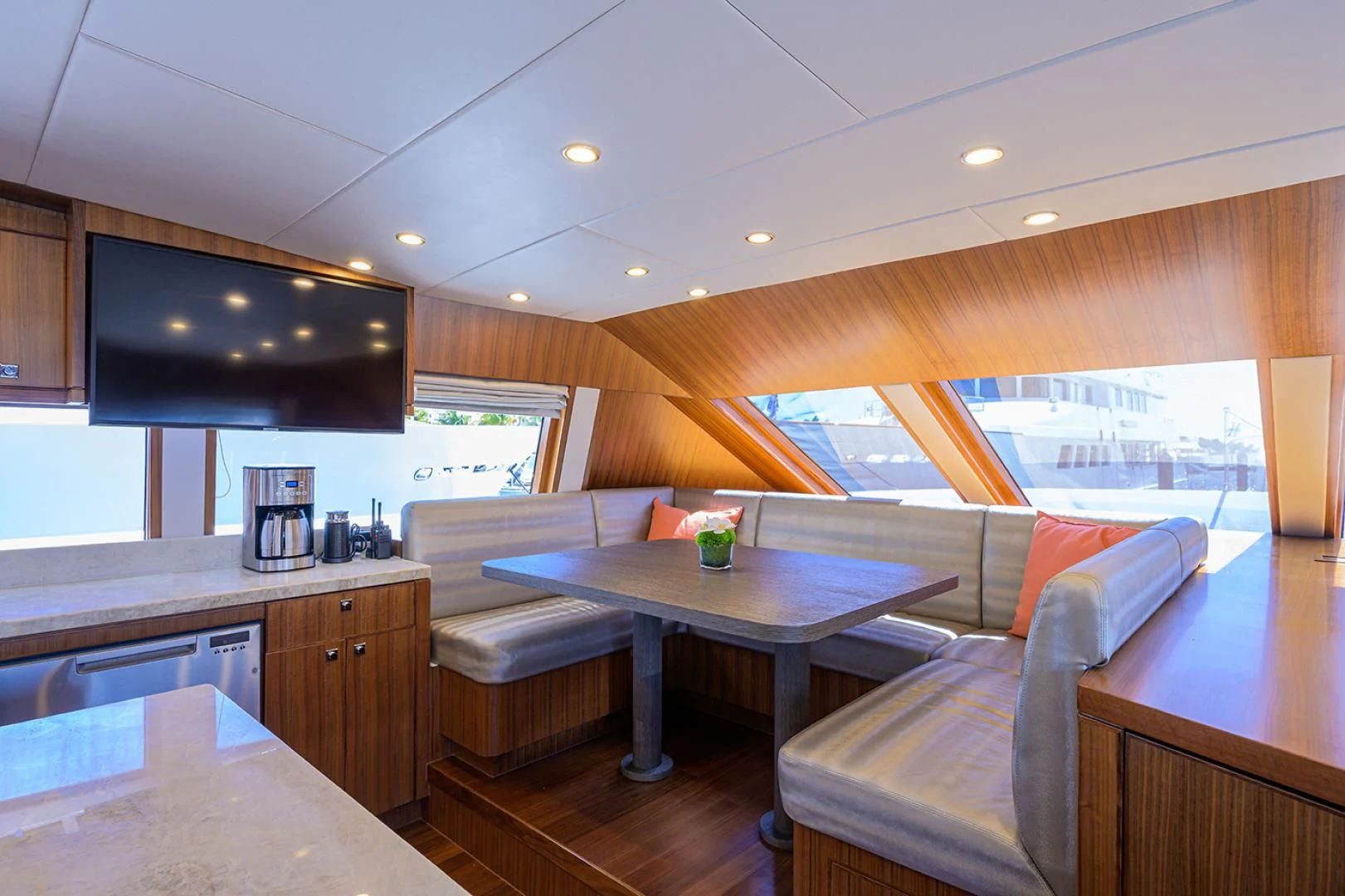 a modern kitchen with a bar and bar area aboard RISK TAKER Yacht for Charter