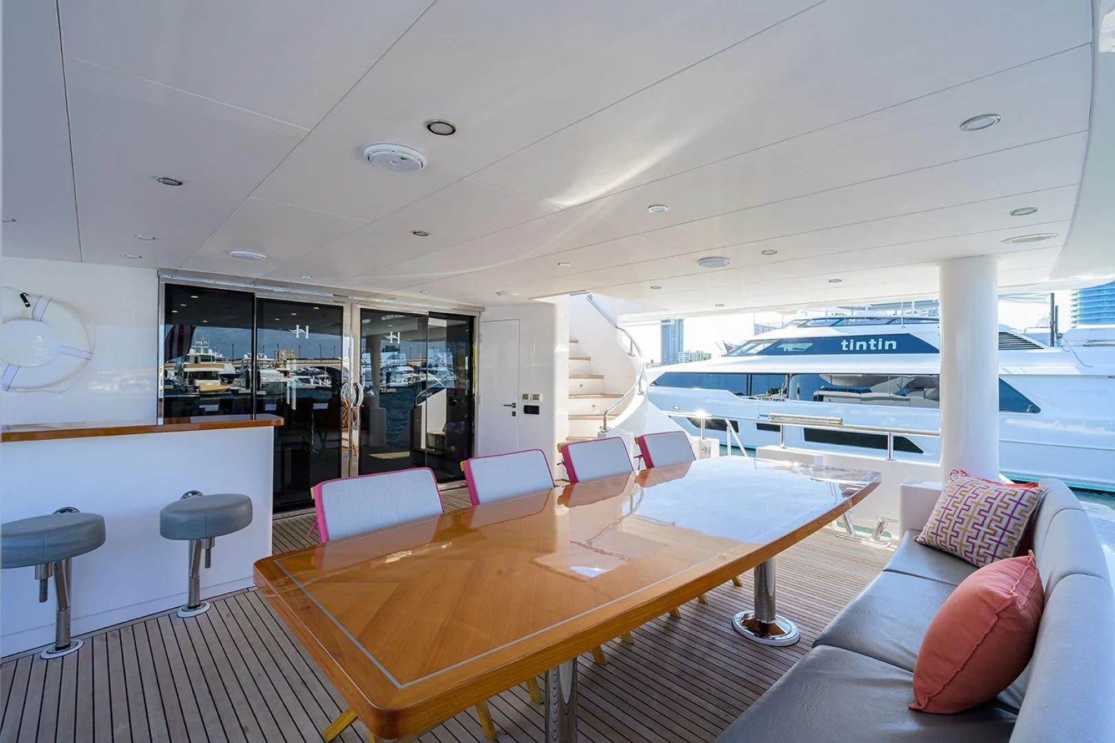 a room with a table and chairs aboard RISK TAKER Yacht for Charter