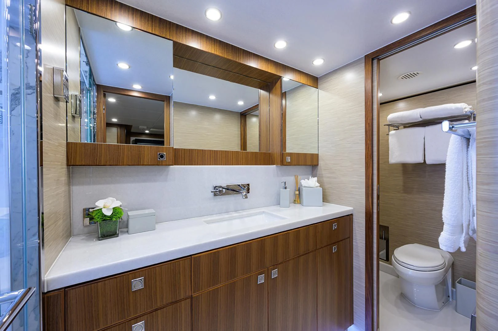 a bathroom with a large mirror aboard RISK TAKER Yacht for Charter