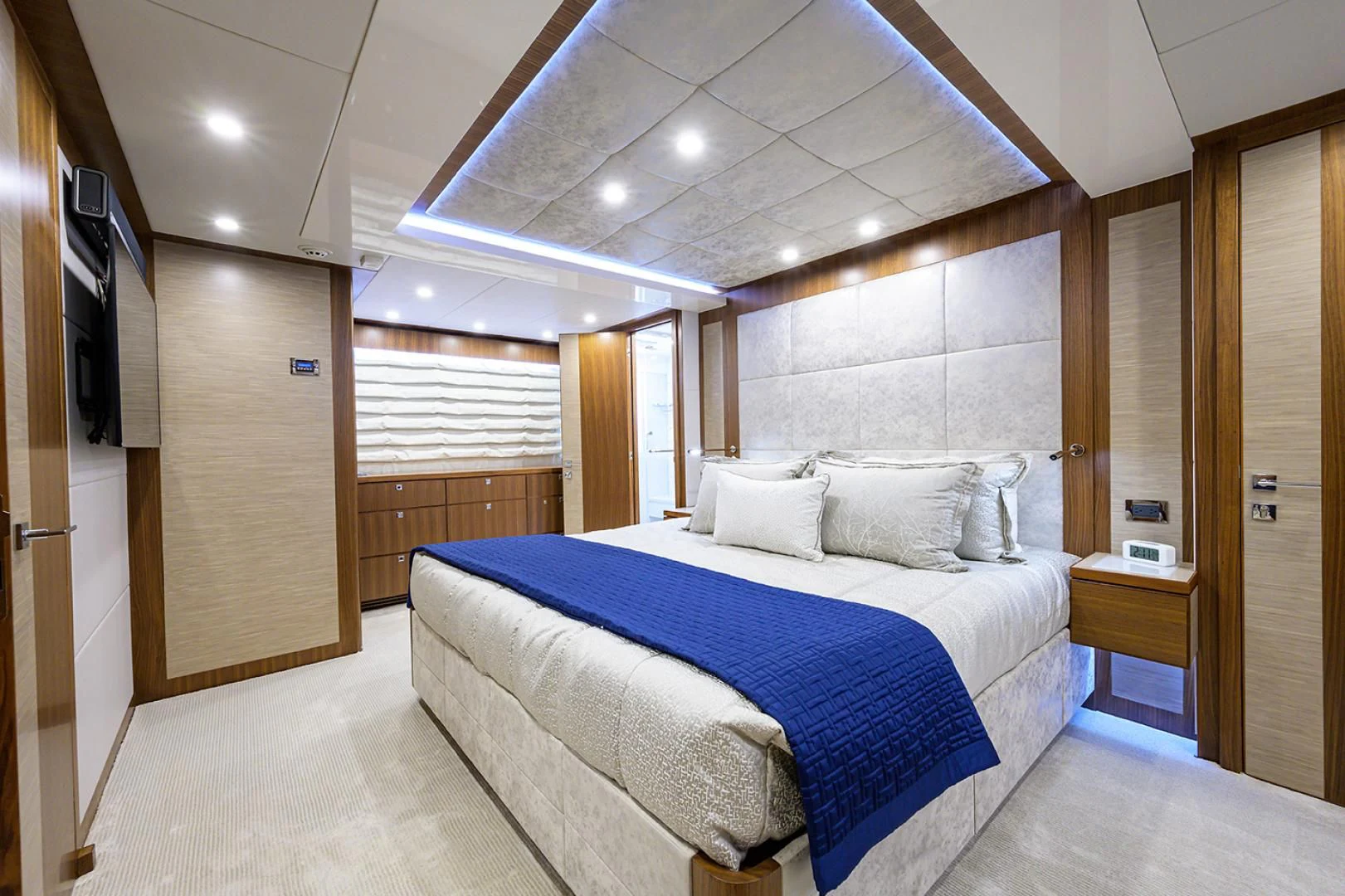 a large bedroom with a bed aboard RISK TAKER Yacht for Charter
