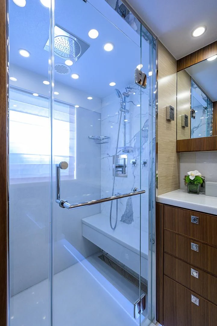 a shower unit in a bathroom aboard RISK TAKER Yacht for Charter