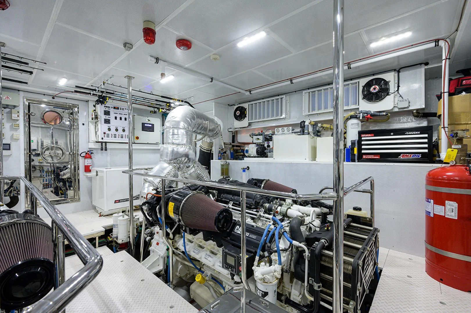a room with machinery and pipes aboard RISK TAKER Yacht for Charter