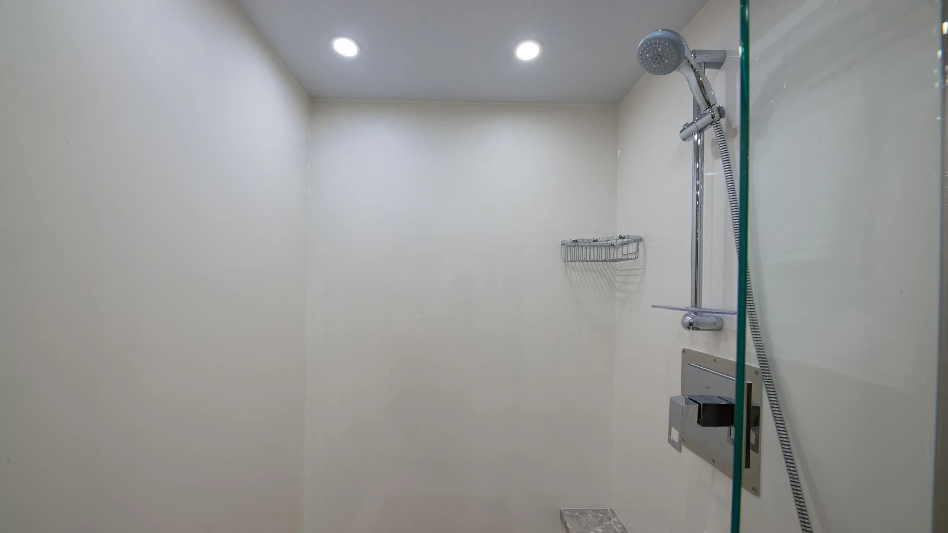 a shower unit in a bathroom aboard RISK TAKER Yacht for Charter