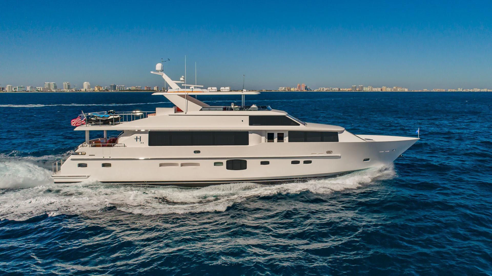 a white yacht on the water aboard RISK TAKER Yacht for Charter