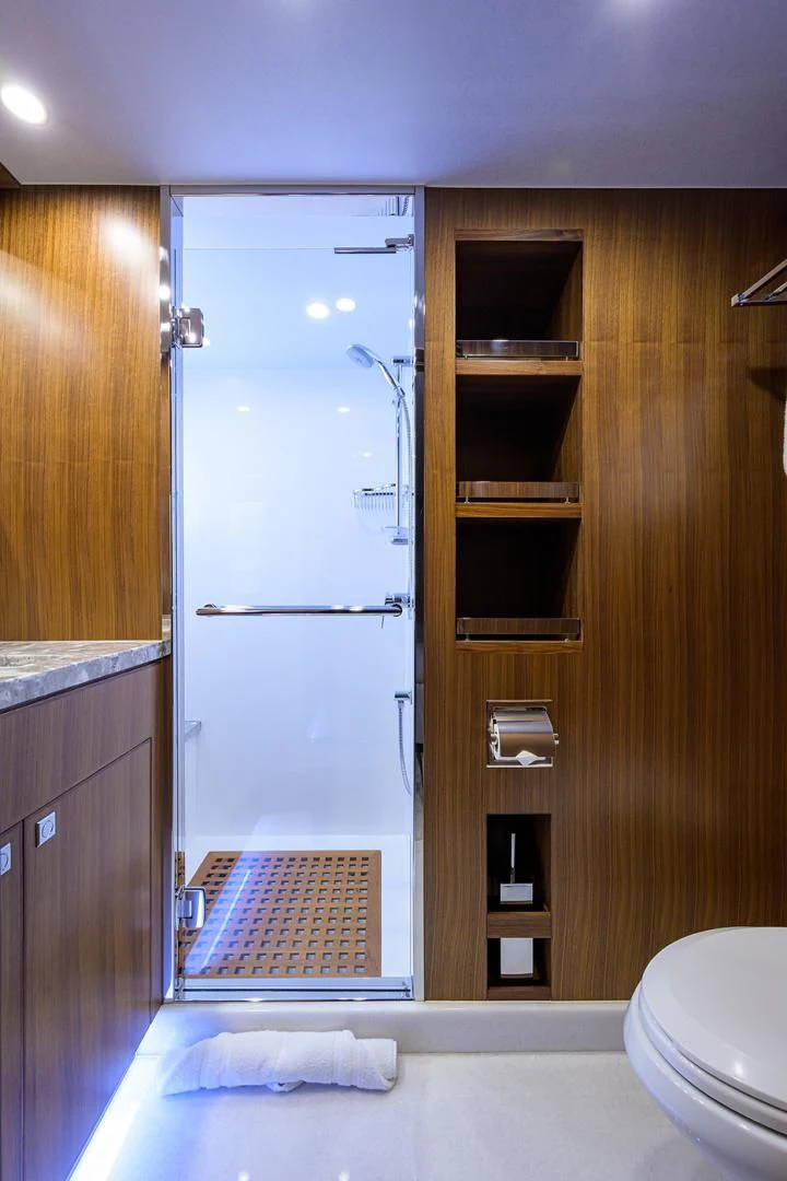 a bathroom with a shower and toilet aboard RISK TAKER Yacht for Charter