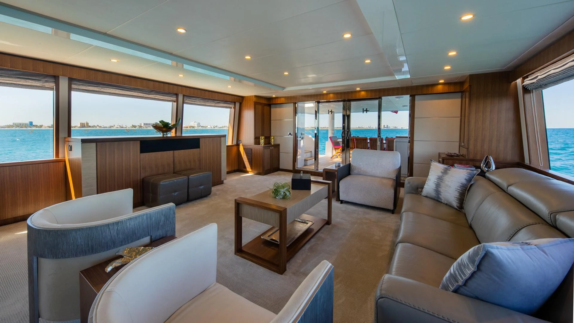 a living room with a couch and a coffee table aboard RISK TAKER Yacht for Charter