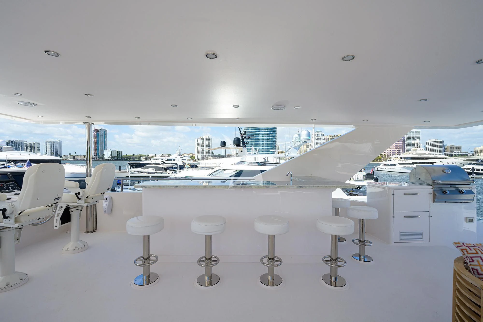 a room with tables and chairs aboard RISK TAKER Yacht for Charter